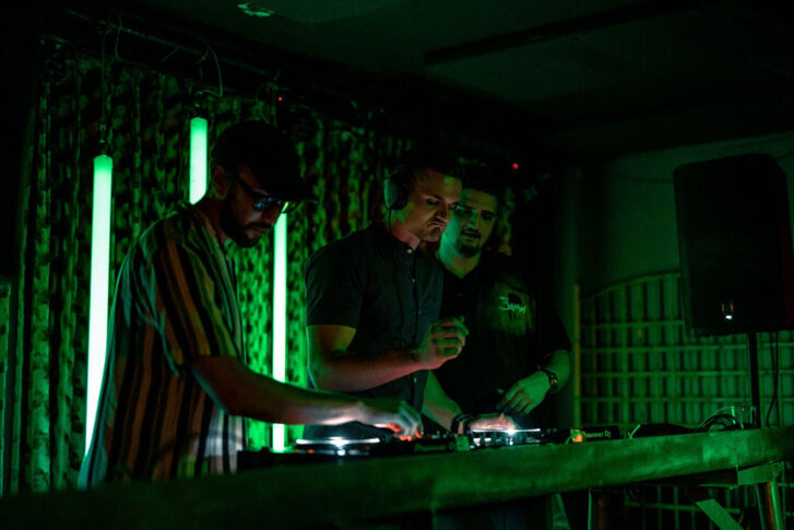 Three DJs spinning at 99ten club