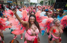 Cariwest Festival ladies dancing on Jasper Avenue parade