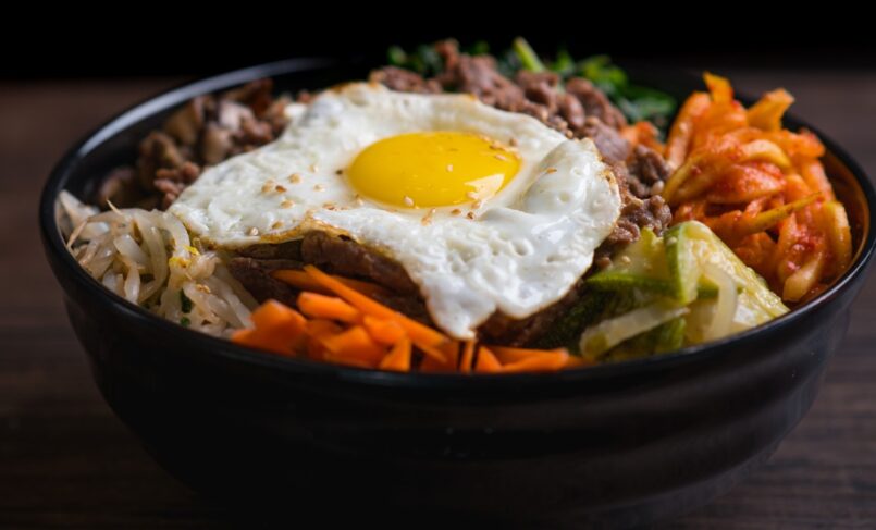 Korean rice bowl topped with egg and beef